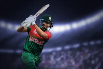 A bettor celebrating a successful wager while watching a live game, capturing the excitement of winning bets on KOKOZINO.