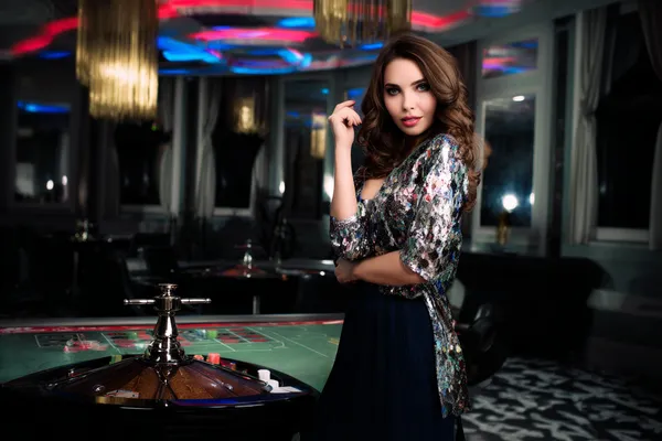 A dramatic shot of winning sevens landing on a slot reel surrounded by shining gold coins, symbolizing big wins.